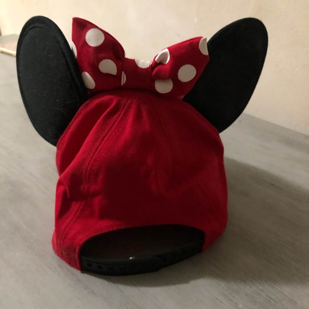 Authentic Disney Minnie Mouse cap with her traditional polka dot bow.